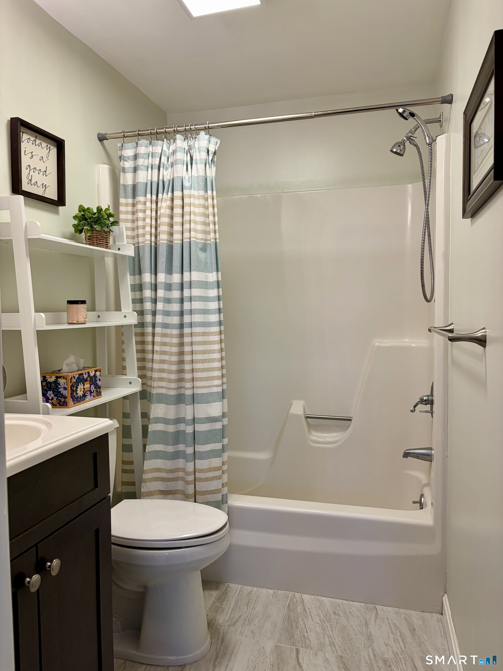 216 Natchaug Drive, Unit 216 Meriden, CT 06450 - Photo 29 of 40 a bathroom with a sink a toilet and shower
