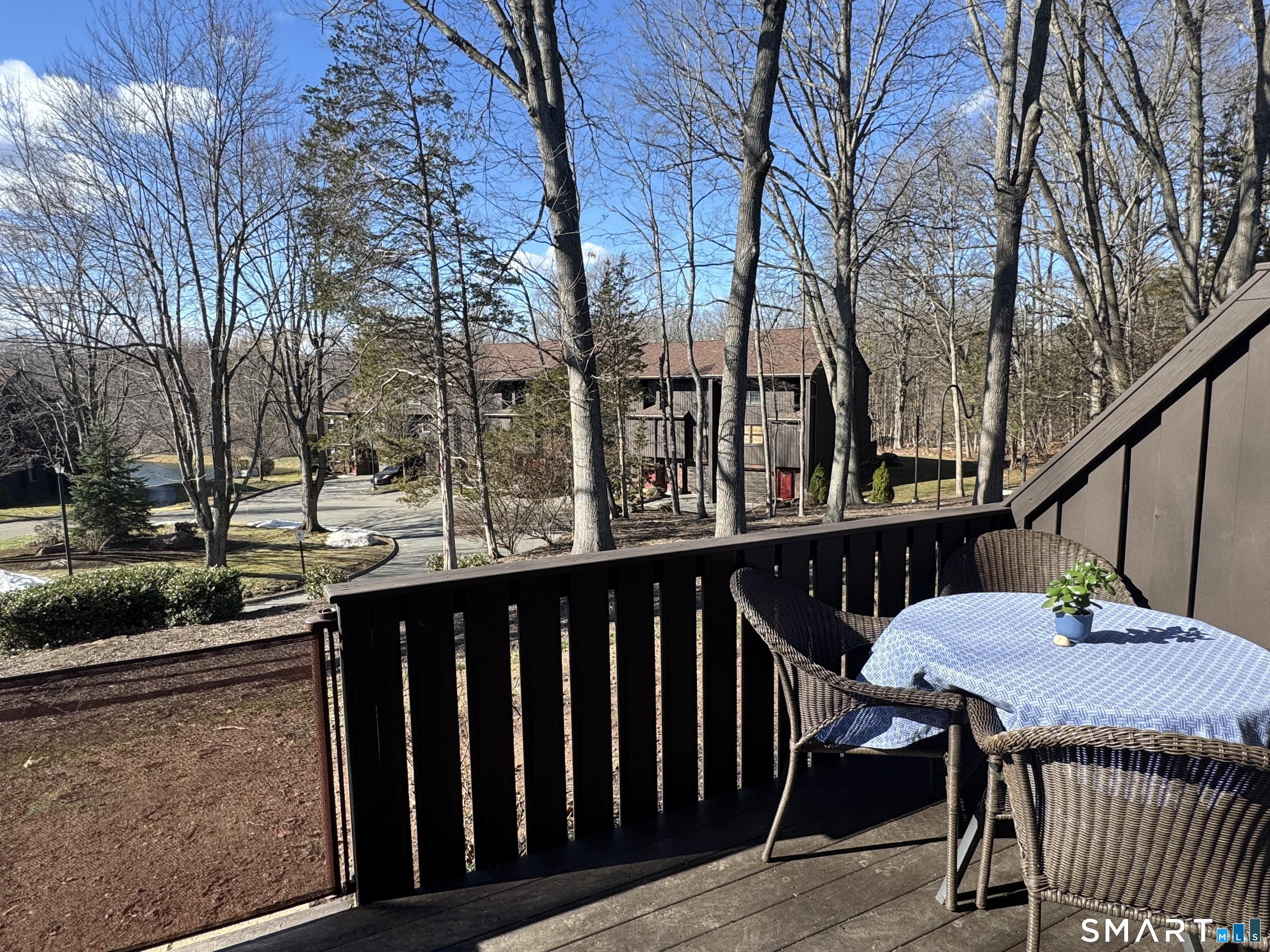 216 Natchaug Drive, Unit 216 Meriden, CT 06450 - Photo 34 of 40 a view of balcony with wooden floor and outdoor seating
