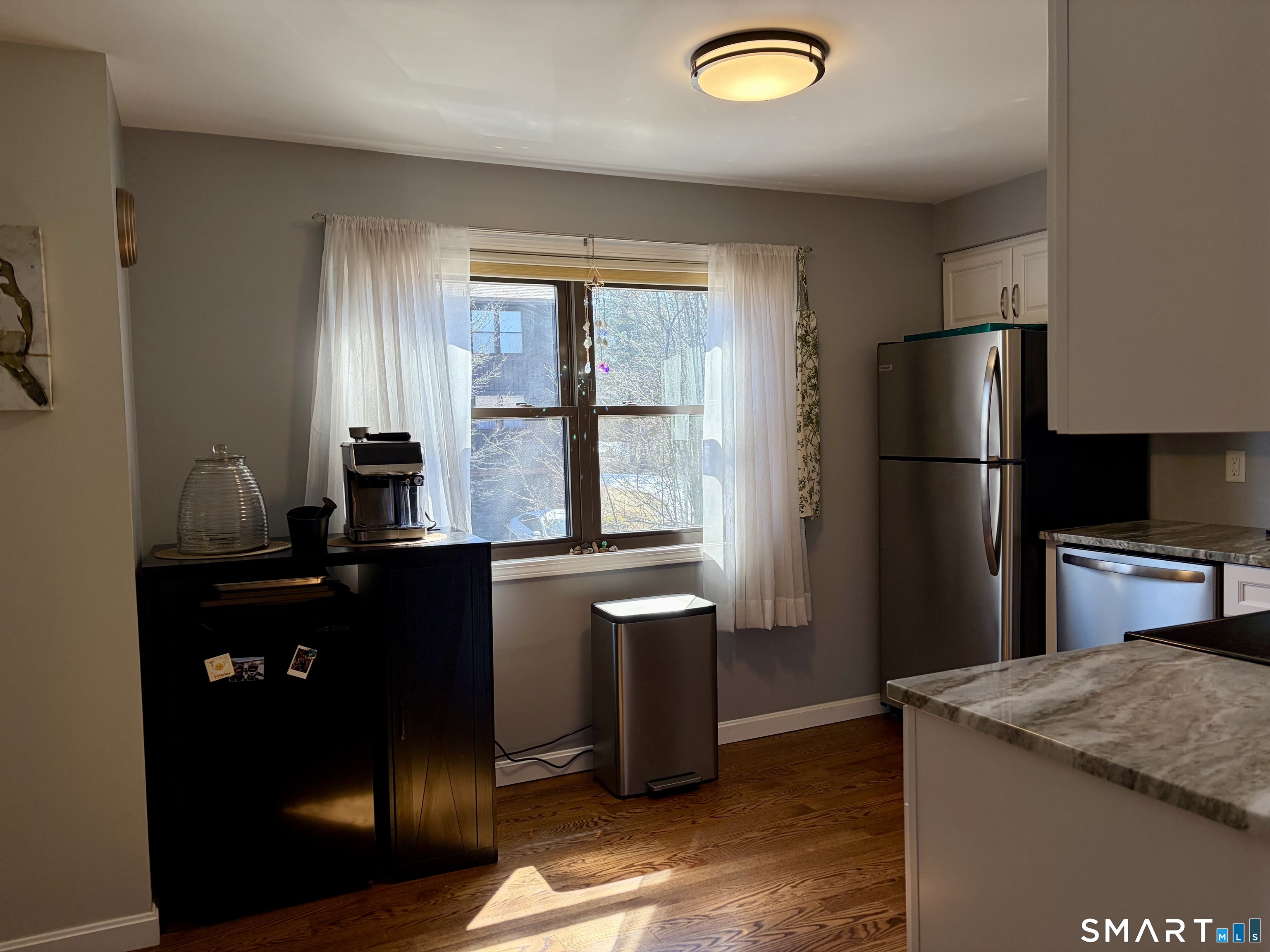216 Natchaug Drive, Unit 216 Meriden, CT 06450 - Photo 8 of 40 a kitchen with a refrigerator and a stove top oven