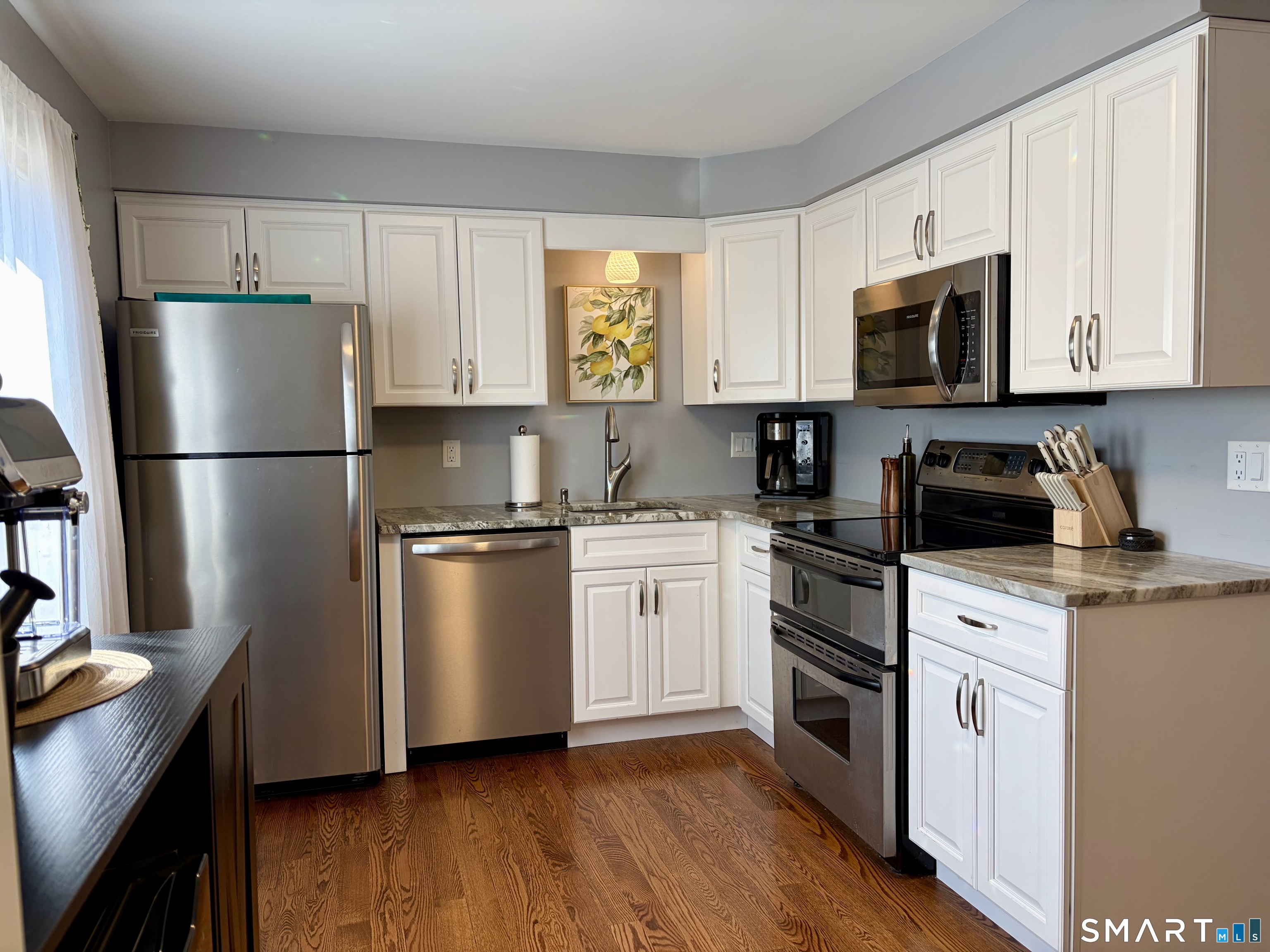 216 Natchaug Drive, Unit 216 Meriden, CT 06450 - Photo 9 of 40 a kitchen with a refrigerator stove and microwave