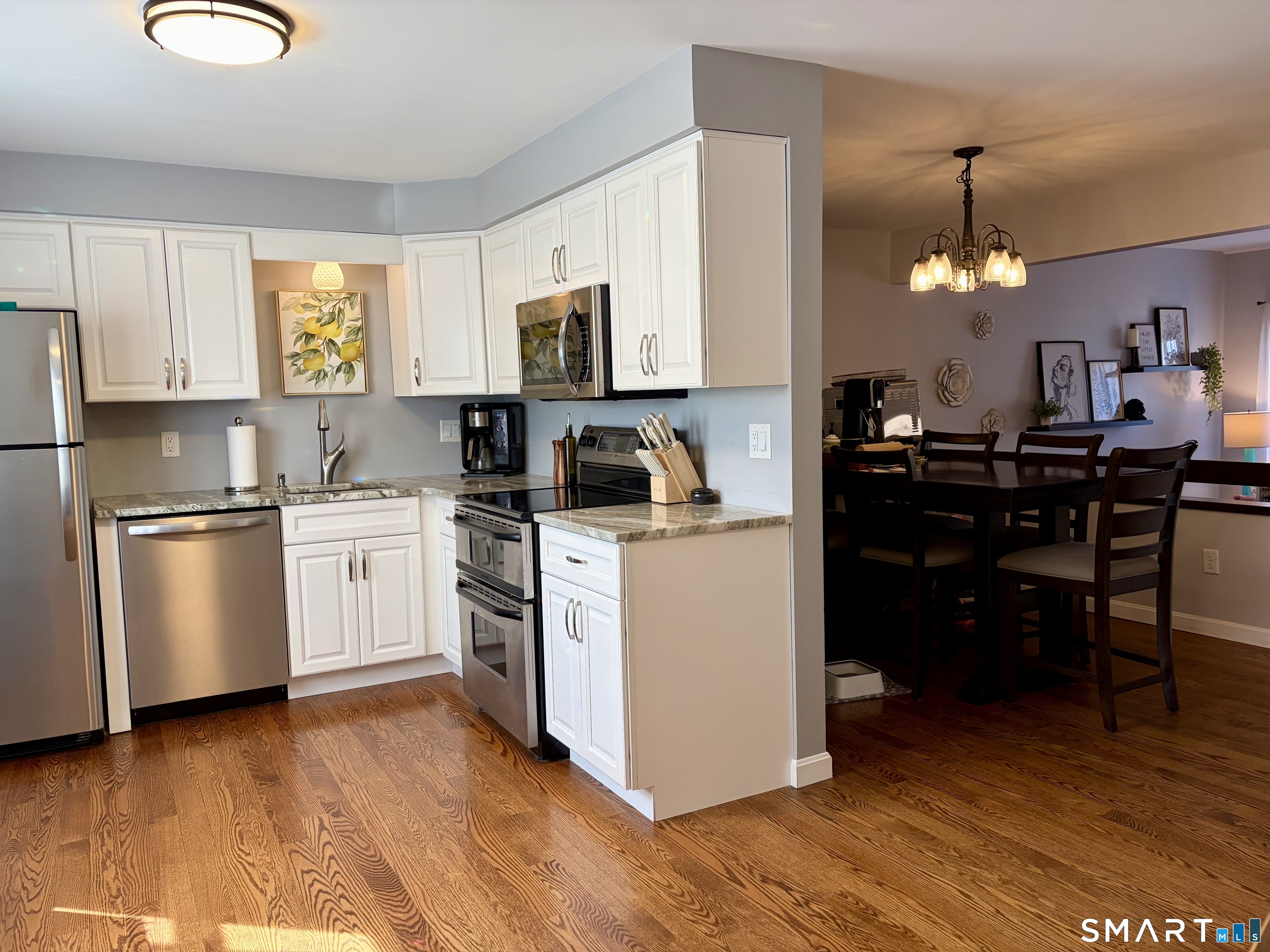 216 Natchaug Drive, Unit 216 Meriden, CT 06450 - Photo 10 of 40 a kitchen that has a lot of white cabinets and stainless steel appliances