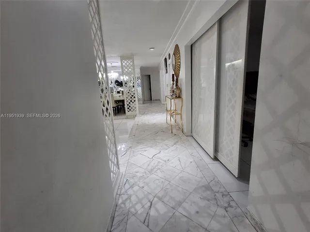 a view of a hallway with a chandelier