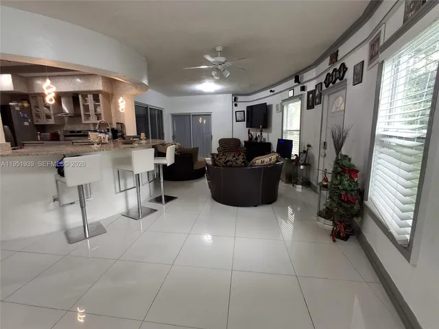 a lobby with furniture and a potted plant