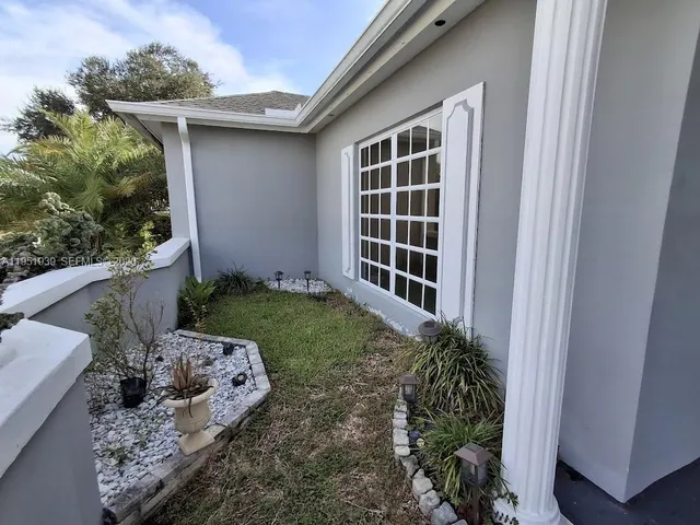 a house view with a garden space
