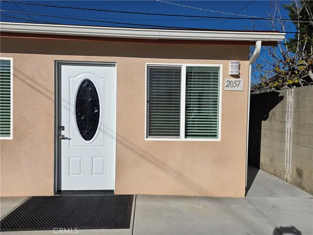 a view of a house with a door and a window
