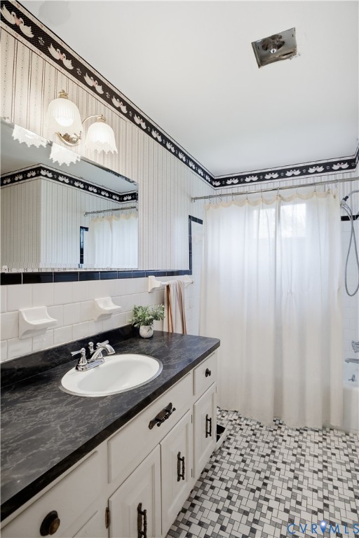 2500 Patricia Road Richmond, VA 23231 - Photo 16 of 34 Bathroom featuring a white vanity with a dark coun