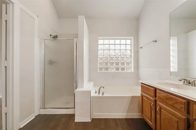 a bathroom with a bathtub and a sink