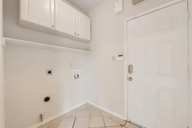 a view of a hallway with a ceiling fan