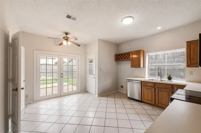 a view of a kitchen with electric appliances