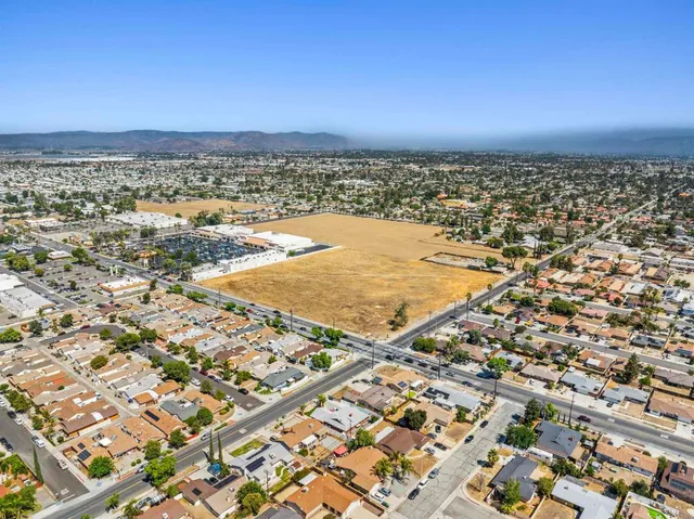 an aerial view of residential building and ocean