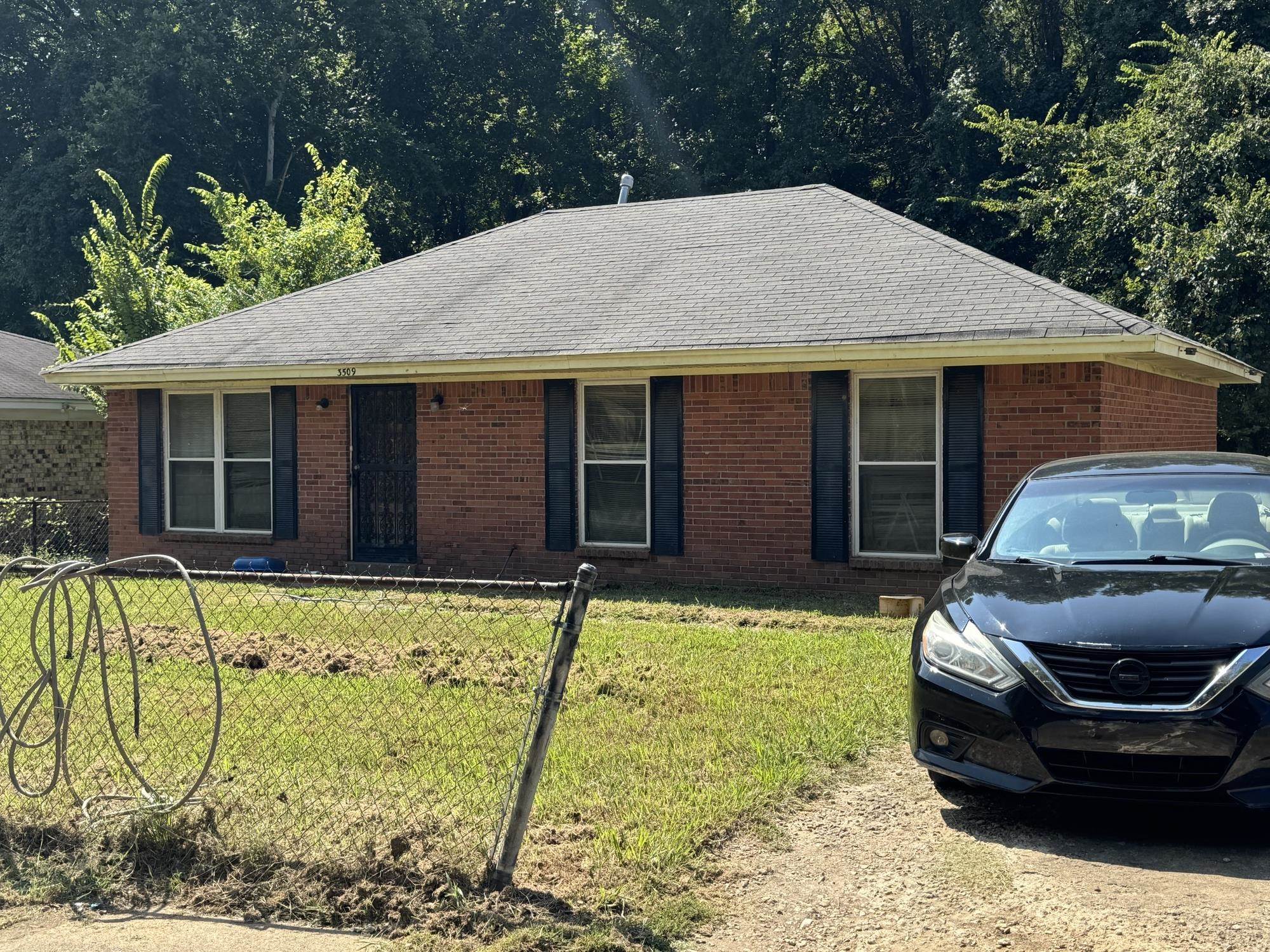 3509 Pine Ridge Lane Memphis, TN 38118 - Photo 2 of 3 a front view of a house with patio