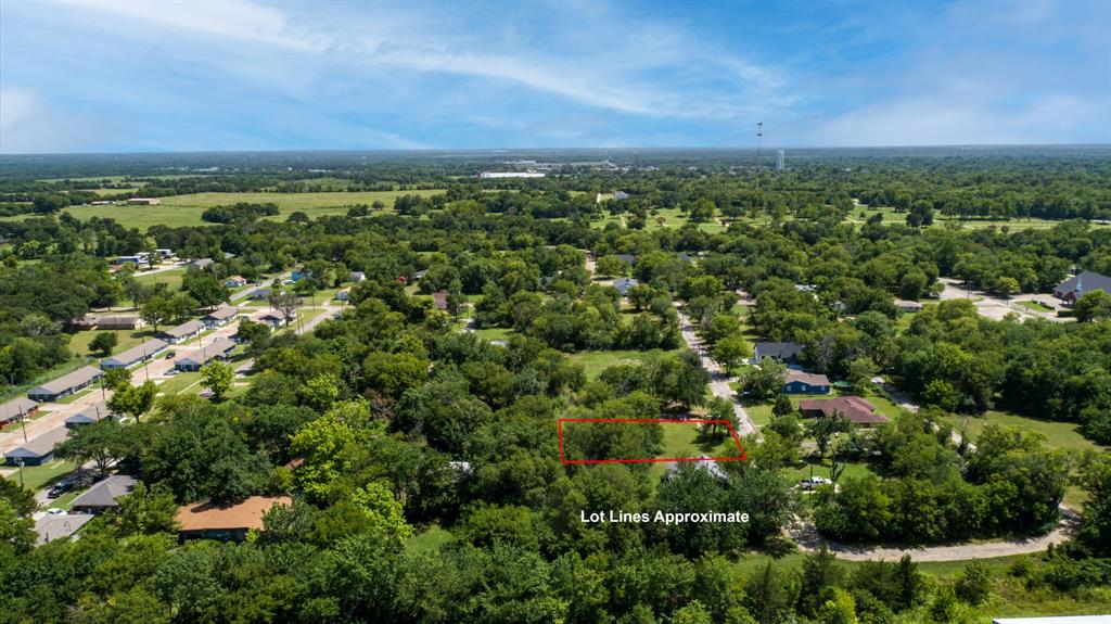 119 Norris Street Commerce, TX 75428 - Photo 8 of 9 an aerial view of a houses with a yard