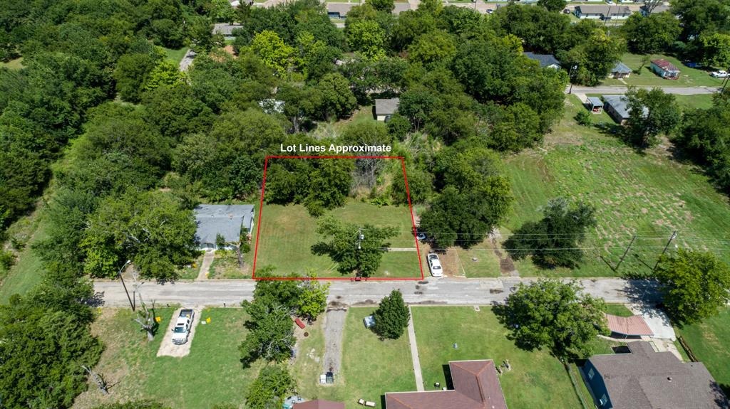 119 Norris Street Commerce, TX 75428 - Photo 9 of 9 an aerial view of a house with a yard