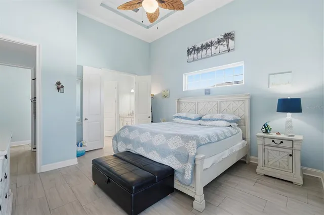 a spacious bathroom with a bathtub sink and mirror