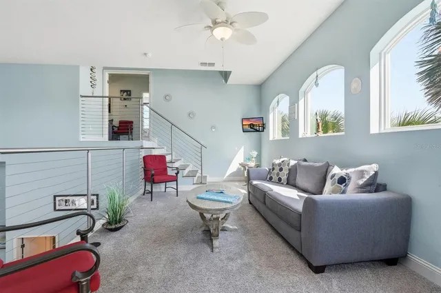 a living room with furniture and white walls