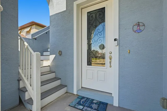 a view of entryway with stairs and wooden floor
