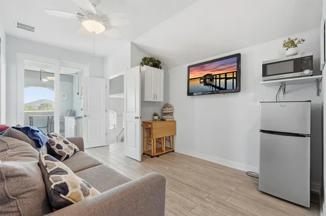 a bedroom with a bed and a desk