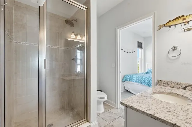 an aerial view of multiple houses with a yard