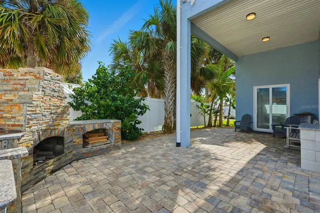 an aerial view of a house with a garden and plants