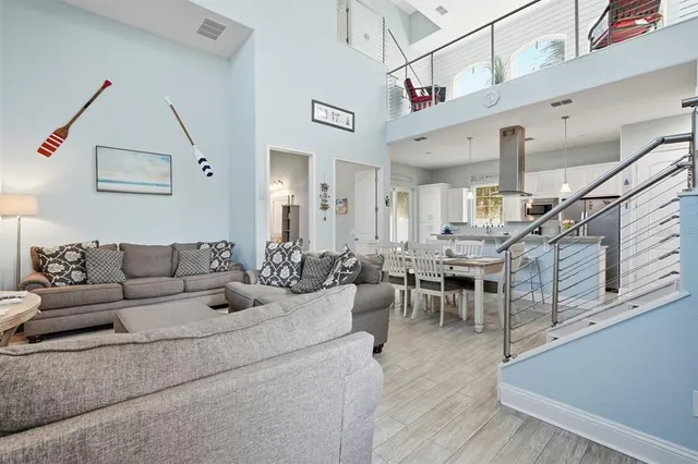 a view of a dining room with furniture and wall clock