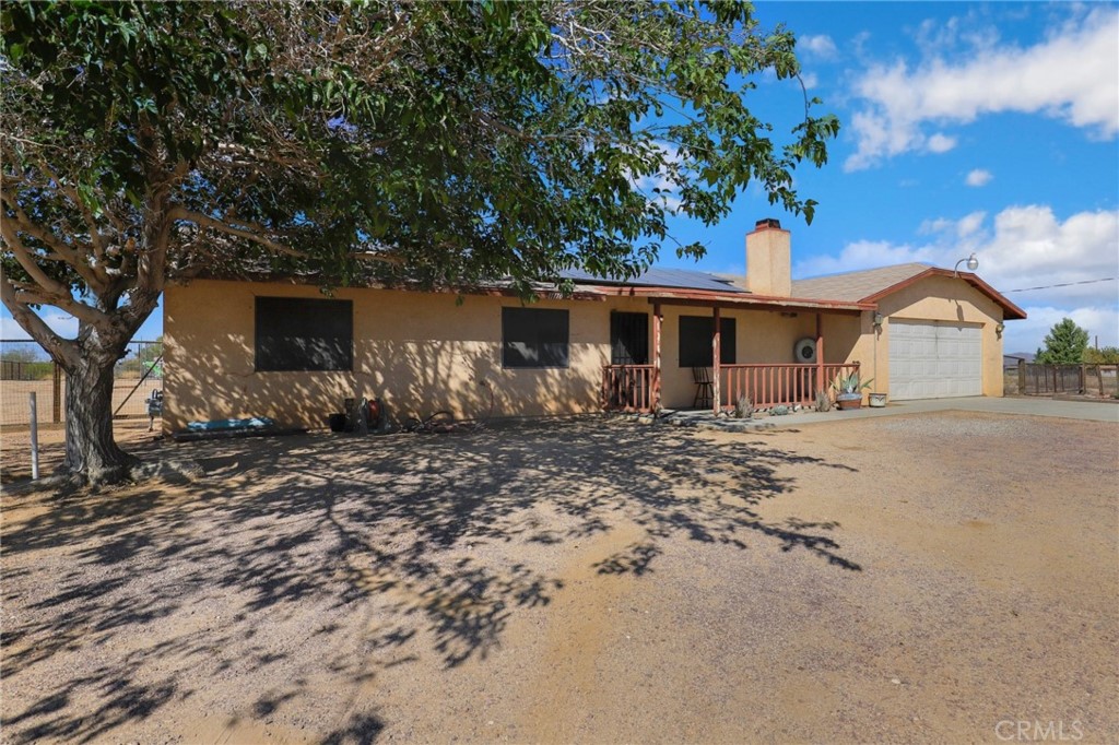11170 Pauhaska Road Apple Valley, CA 92308 - Photo 1 of 1 a front view of a house with garden