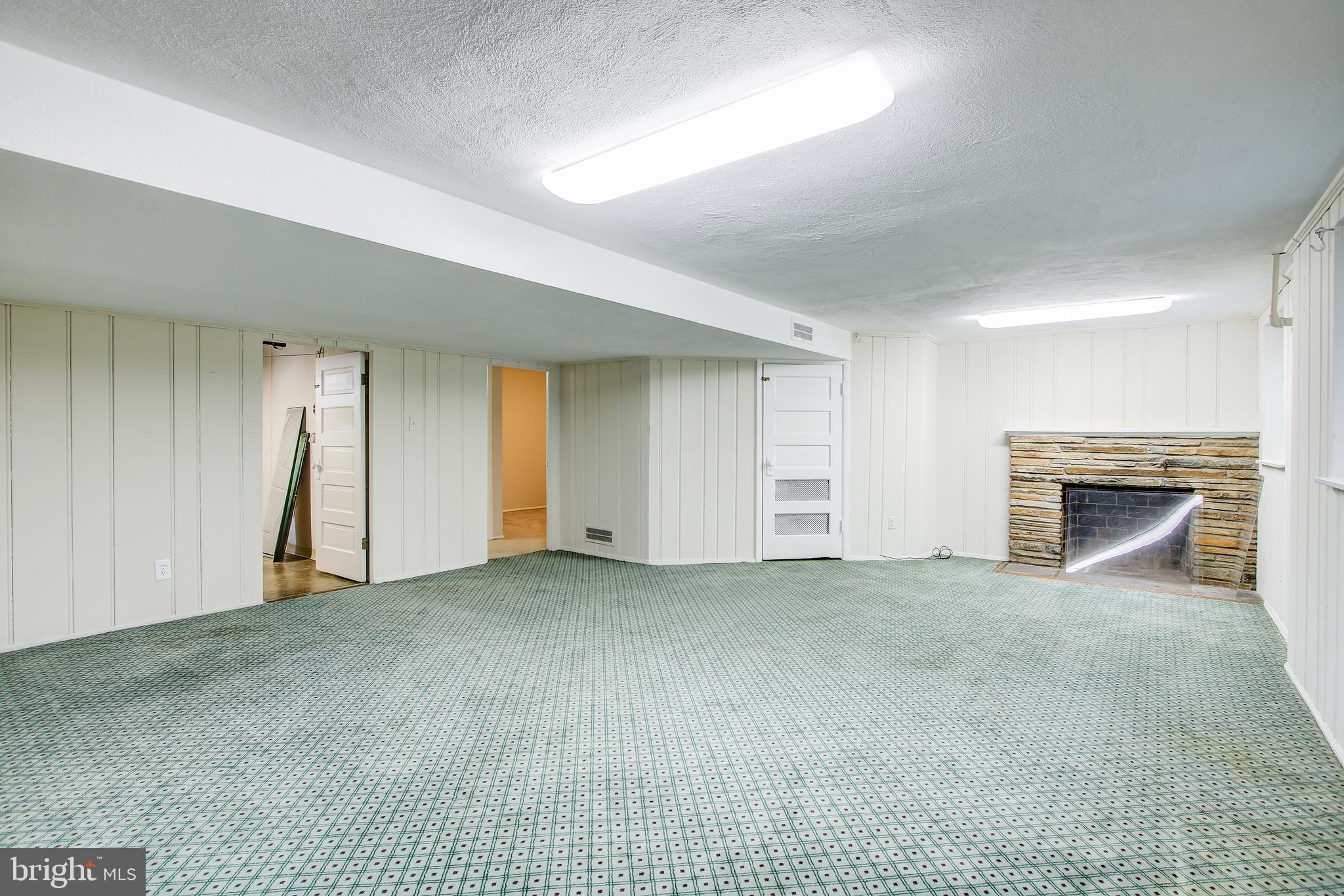 5629 Lambeth Road Bethesda, MD 20814 - Photo 22 of 32 Lower Level Rec Room with Fireplace