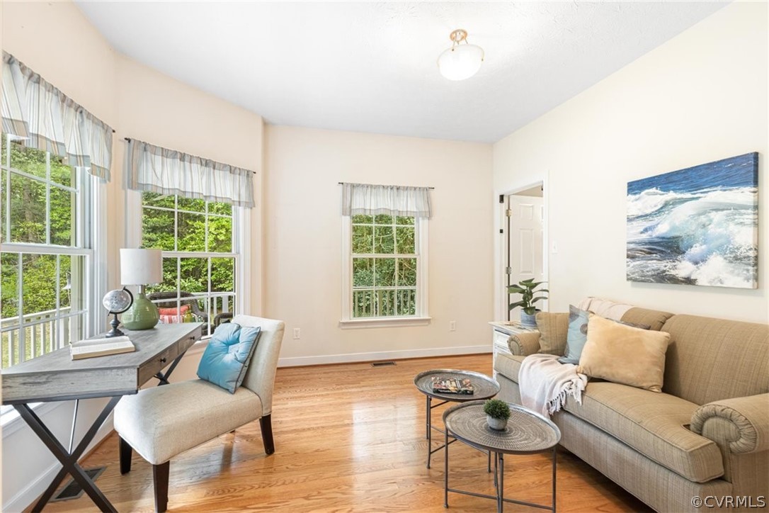 3521 Wakema Road West Point, VA 23181 - Photo 23 of 49 a living room with furniture and floor to ceiling windows