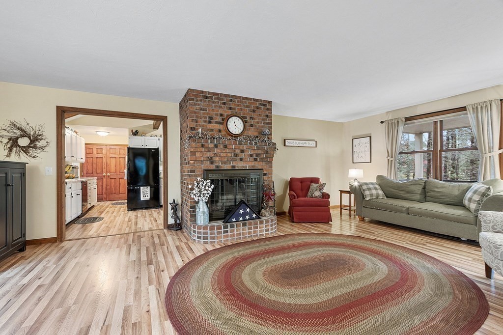 911 Conant Road Athol, MA 01331 - Photo 8 of 34 a living room with furniture and a fireplace
