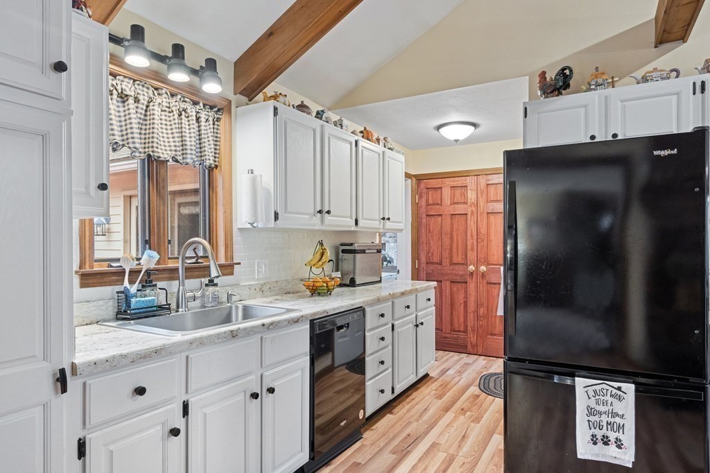 911 Conant Road Athol, MA 01331 - Photo 9 of 34 a kitchen with stainless steel appliances a refrigerator sink and cabinets