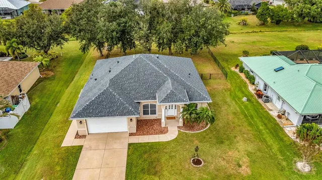 a large kitchen with granite countertop a sink and stainless steel appliances