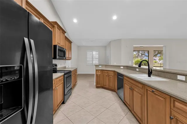 a kitchen with stainless steel appliances granite countertop a sink and dishwasher
