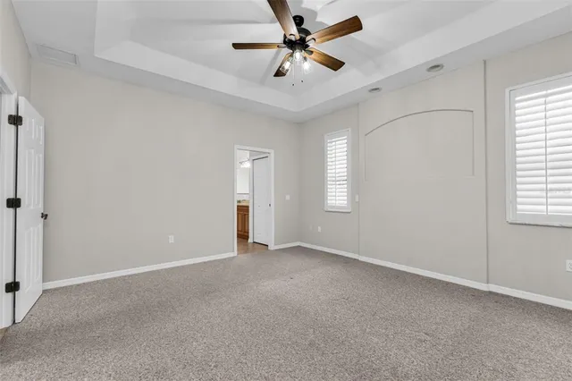 a spacious bathroom with a granite countertop sink mirror and