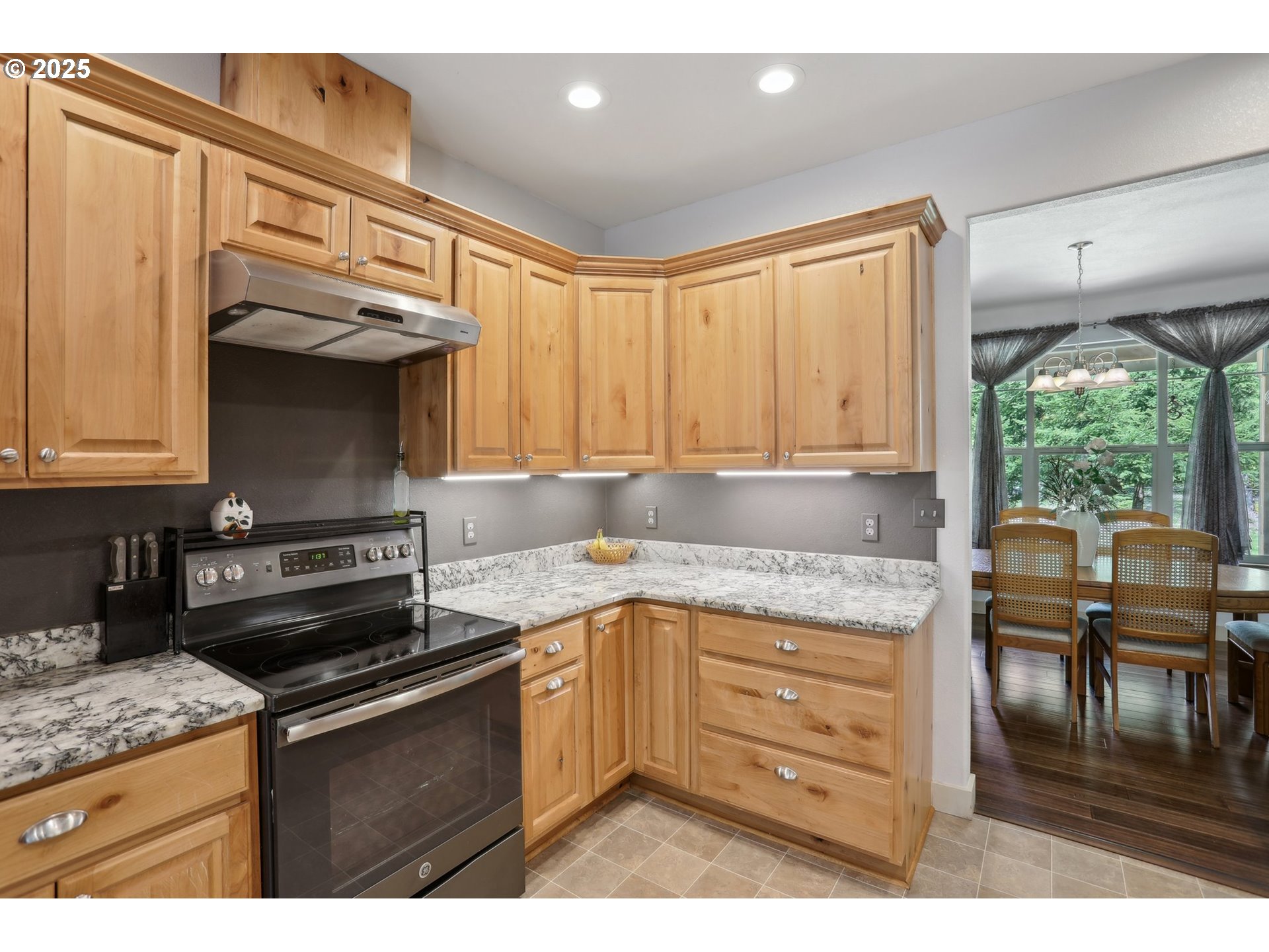 230 Riley Court Toutle, WA 98649 - Photo 21 of 48 a kitchen with a stove a sink and a microwave