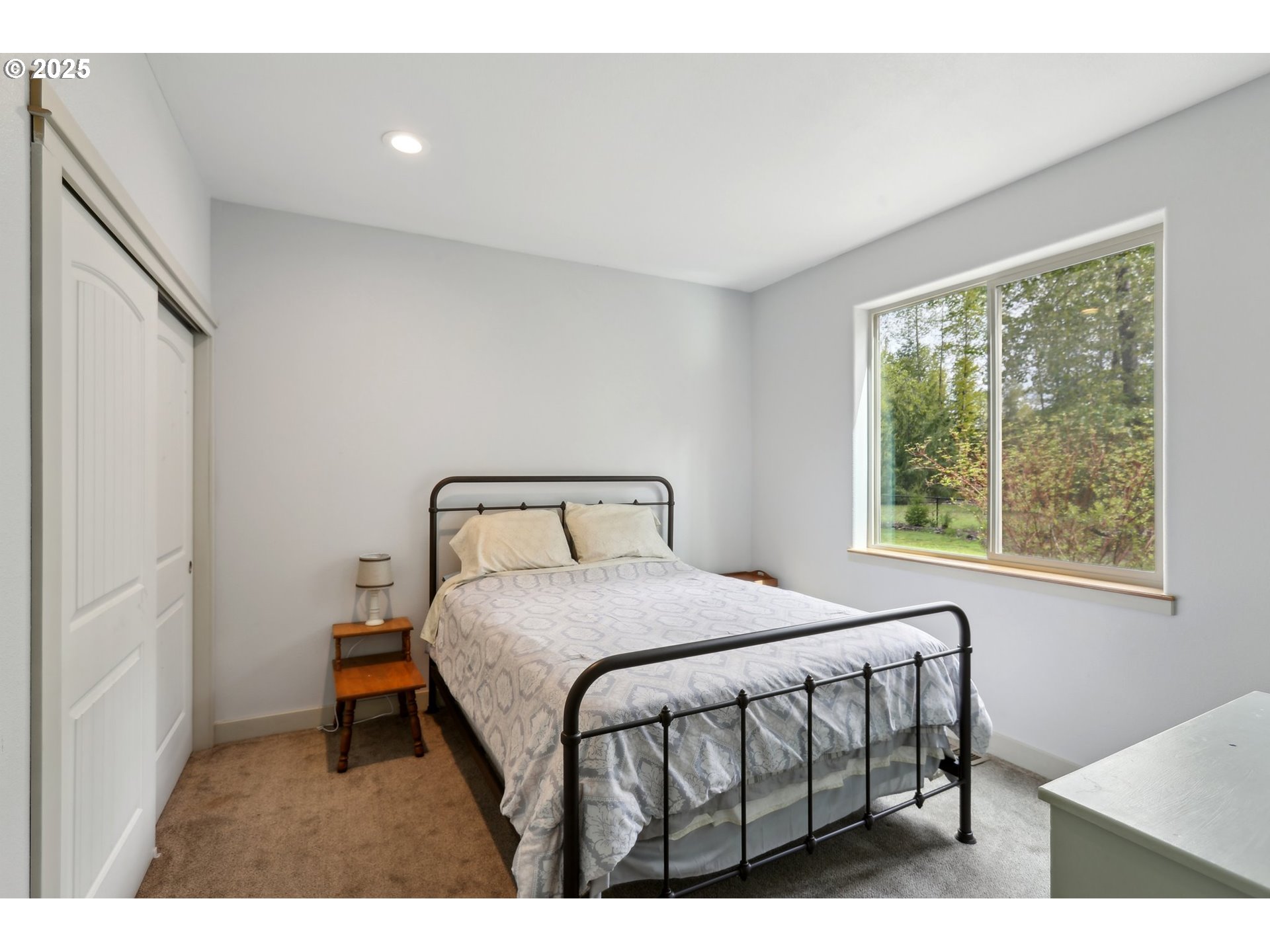 230 Riley Court Toutle, WA 98649 - Photo 35 of 48 a bedroom with a bed a window and outside view