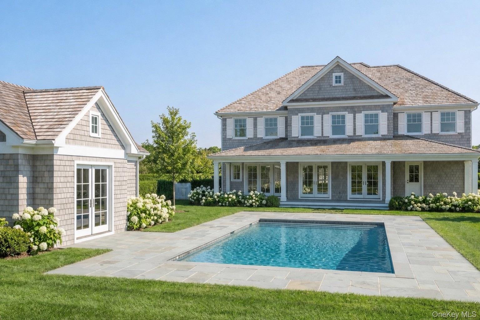 39 Hildreth Street Southampton, NY 11968 - Photo 4 of 8 a front view of a house with a yard