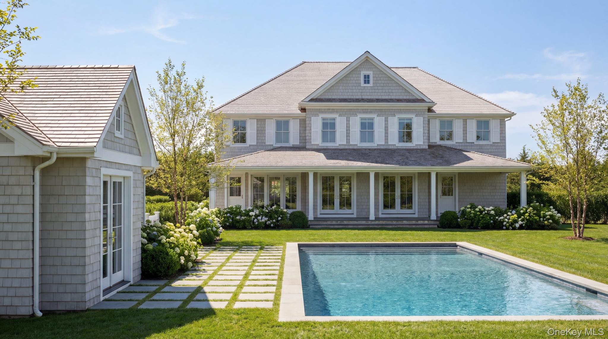 39 Hildreth Street Southampton, NY 11968 - Photo 6 of 8 a front view of a house with yard and green space
