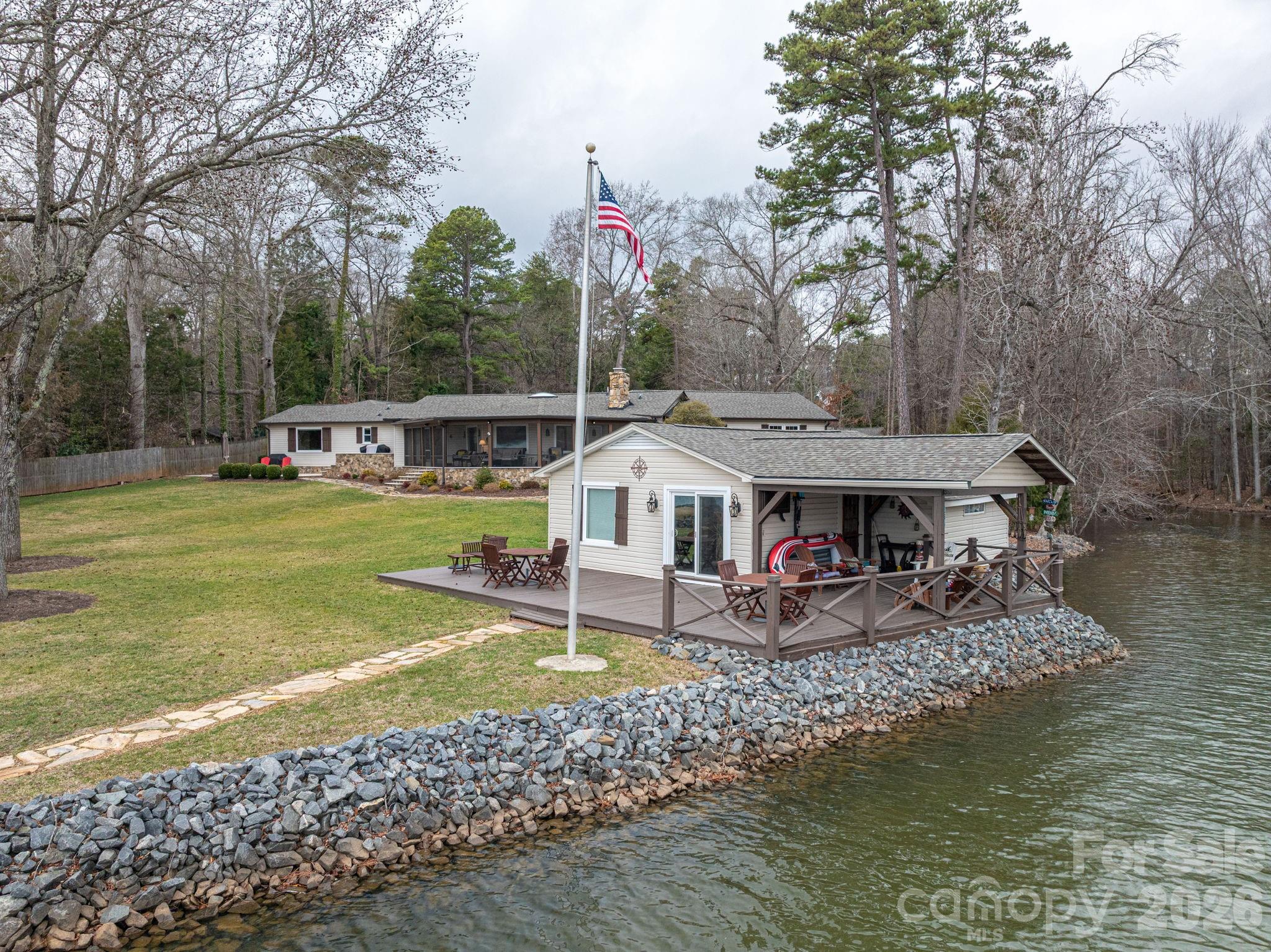 4485 River Oaks Road Lake Wylie, SC 29710 - Photo 16 of 16 a view of a house with swimming pool and next to a lake