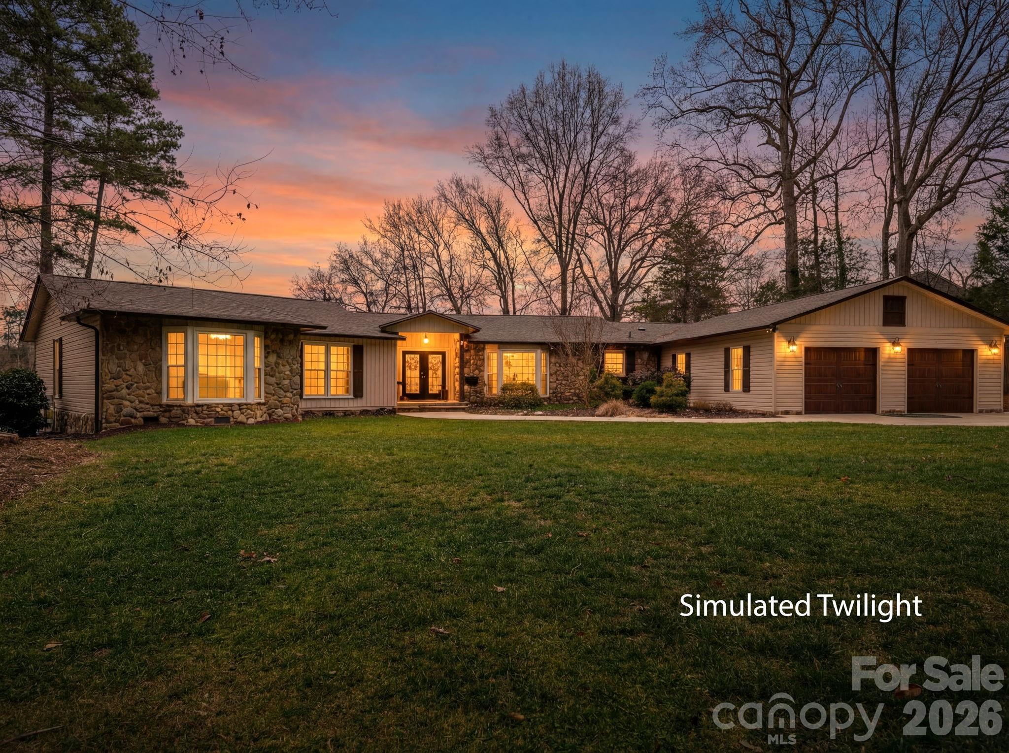 4485 River Oaks Road Lake Wylie, SC 29710 - Photo 2 of 16 a front view of a house with a garden