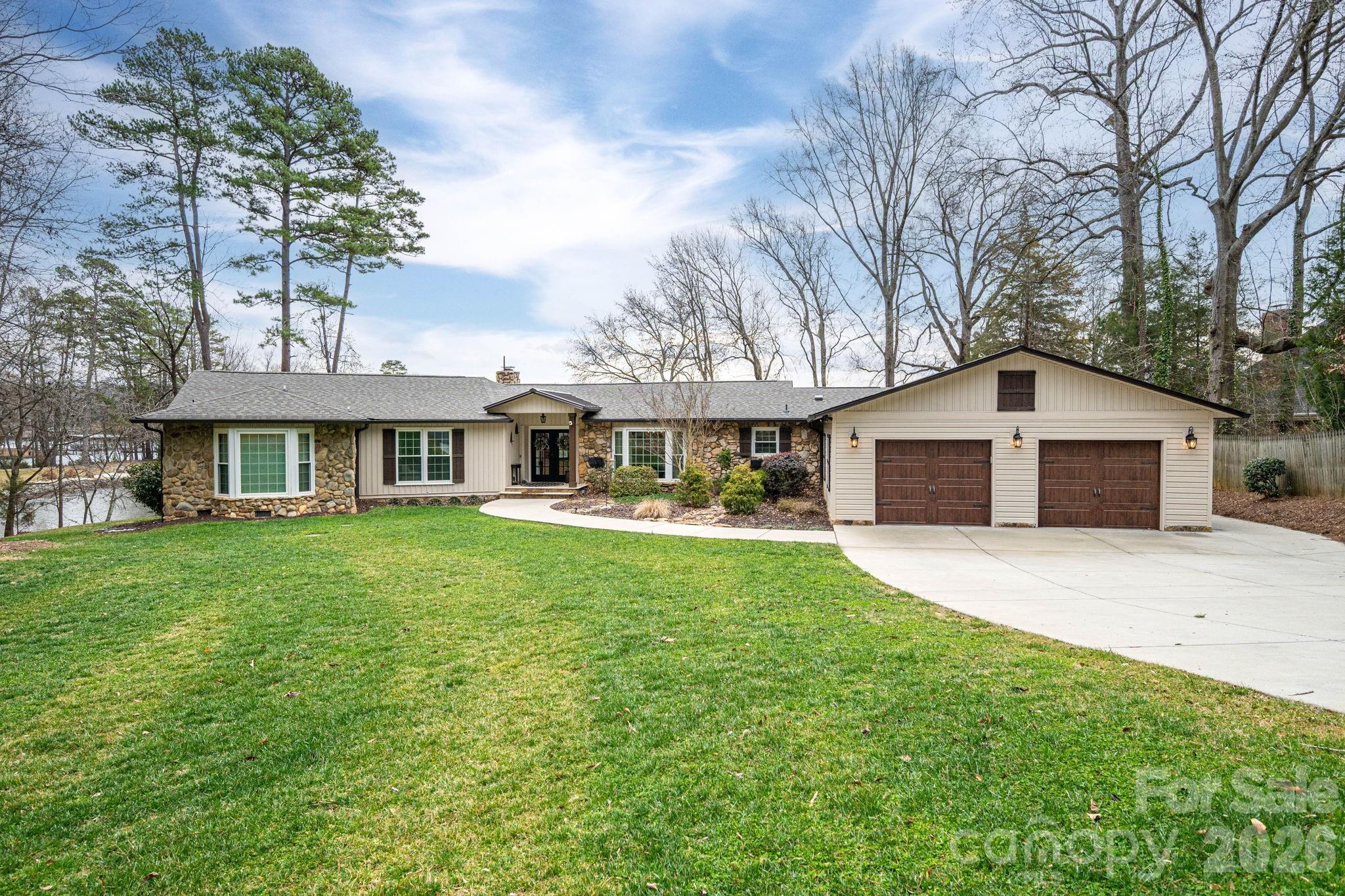 4485 River Oaks Road Lake Wylie, SC 29710 - Photo 3 of 16 a front view of house with yard and green space