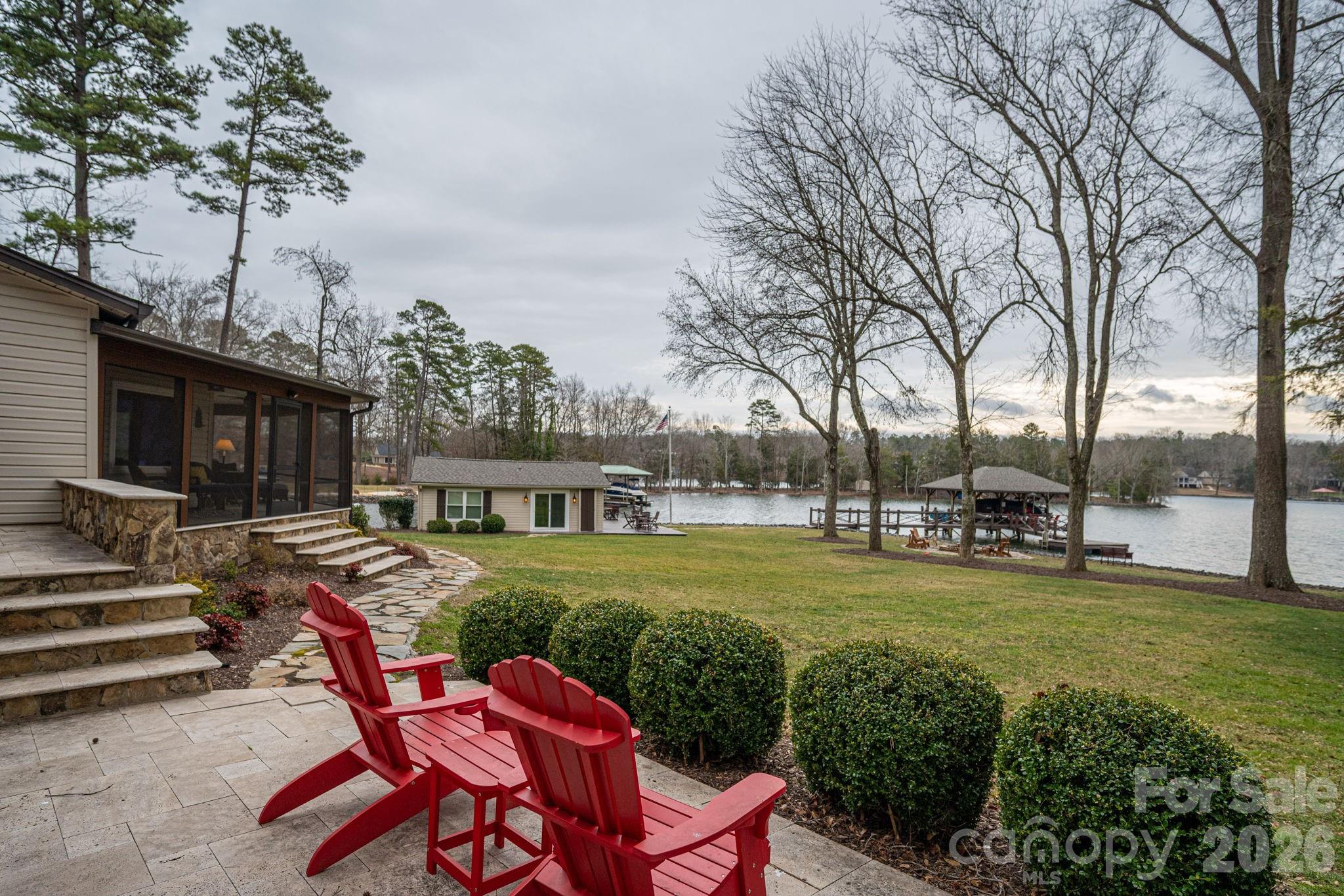 4485 River Oaks Road Lake Wylie, SC 29710 - Photo 8 of 16 a view of a house with backyard porch and sitting area