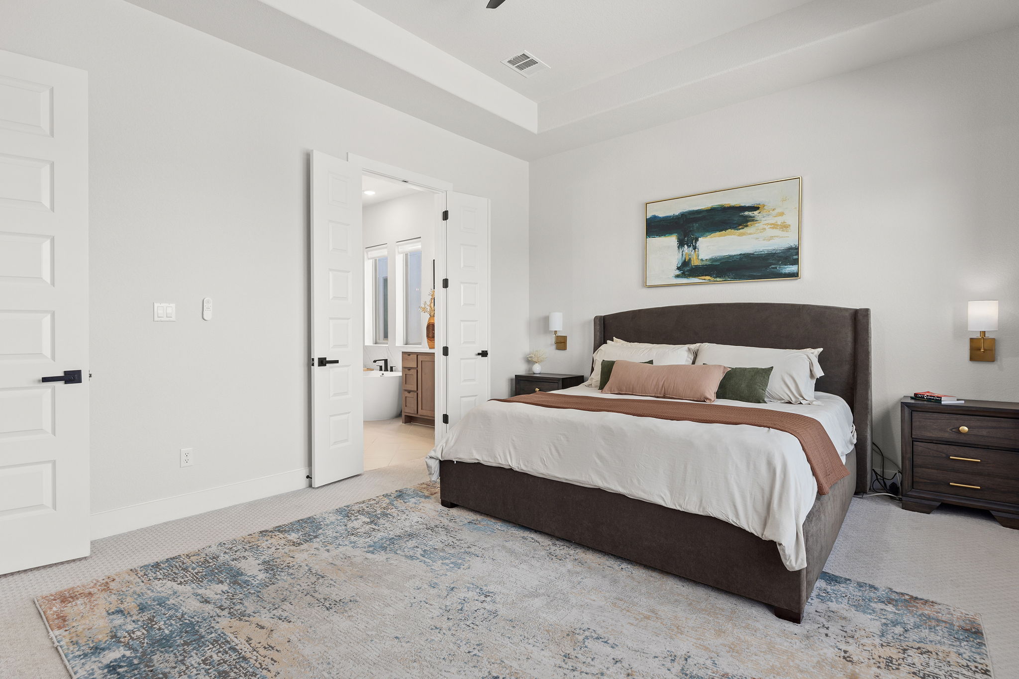 1224 River Trace Georgetown, TX 78628 - Photo 19 of 39 a spacious bedroom with a bed and a view of bathroom