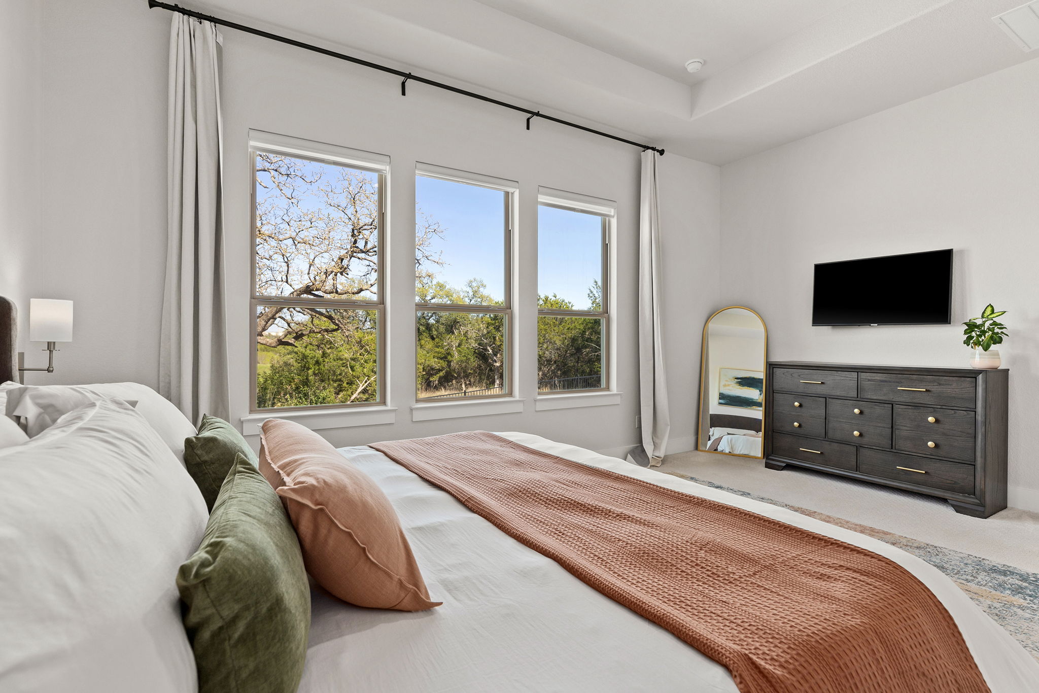 1224 River Trace Georgetown, TX 78628 - Photo 20 of 39 a bedroom with a bed a television and large window