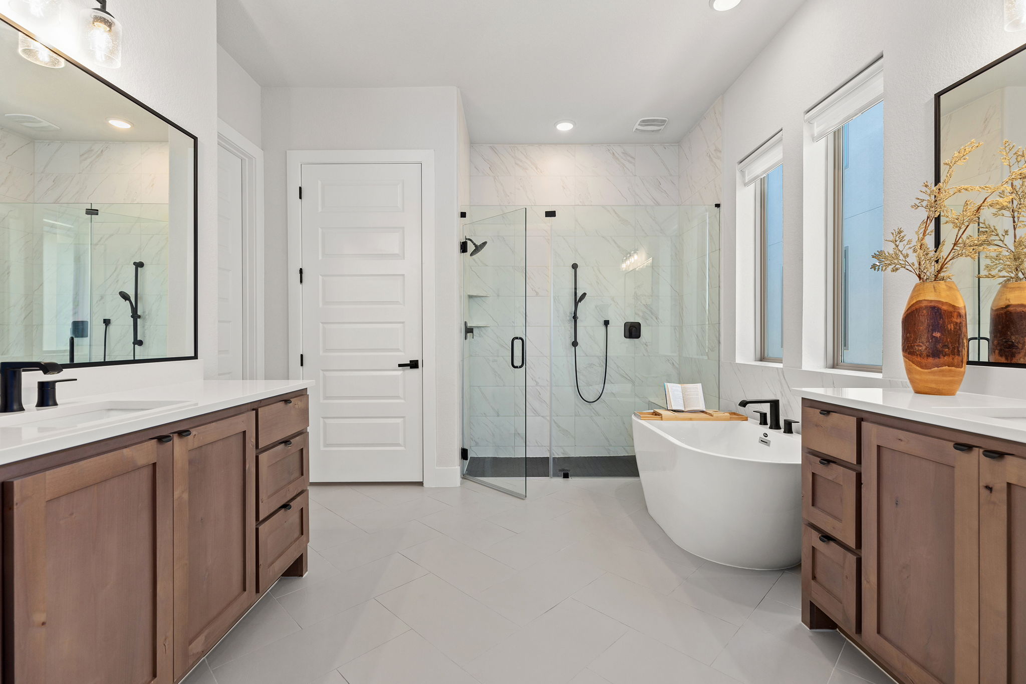 1224 River Trace Georgetown, TX 78628 - Photo 21 of 39 a spacious bathroom with a double vanity sink mirror and a bathtub