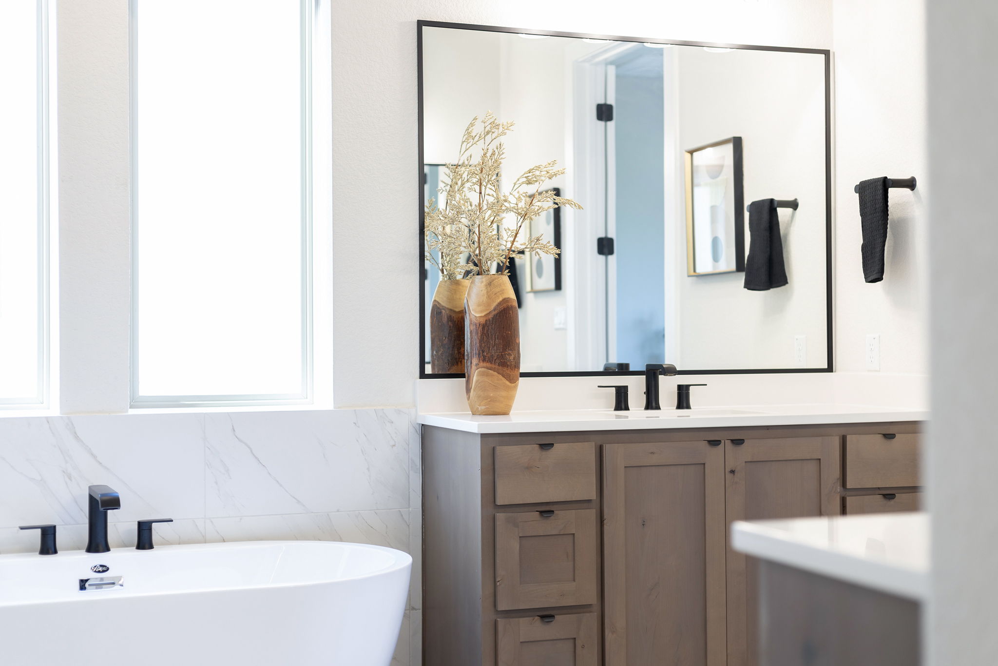 1224 River Trace Georgetown, TX 78628 - Photo 23 of 39 a bathroom with a double vanity sink mirror and bathtub
