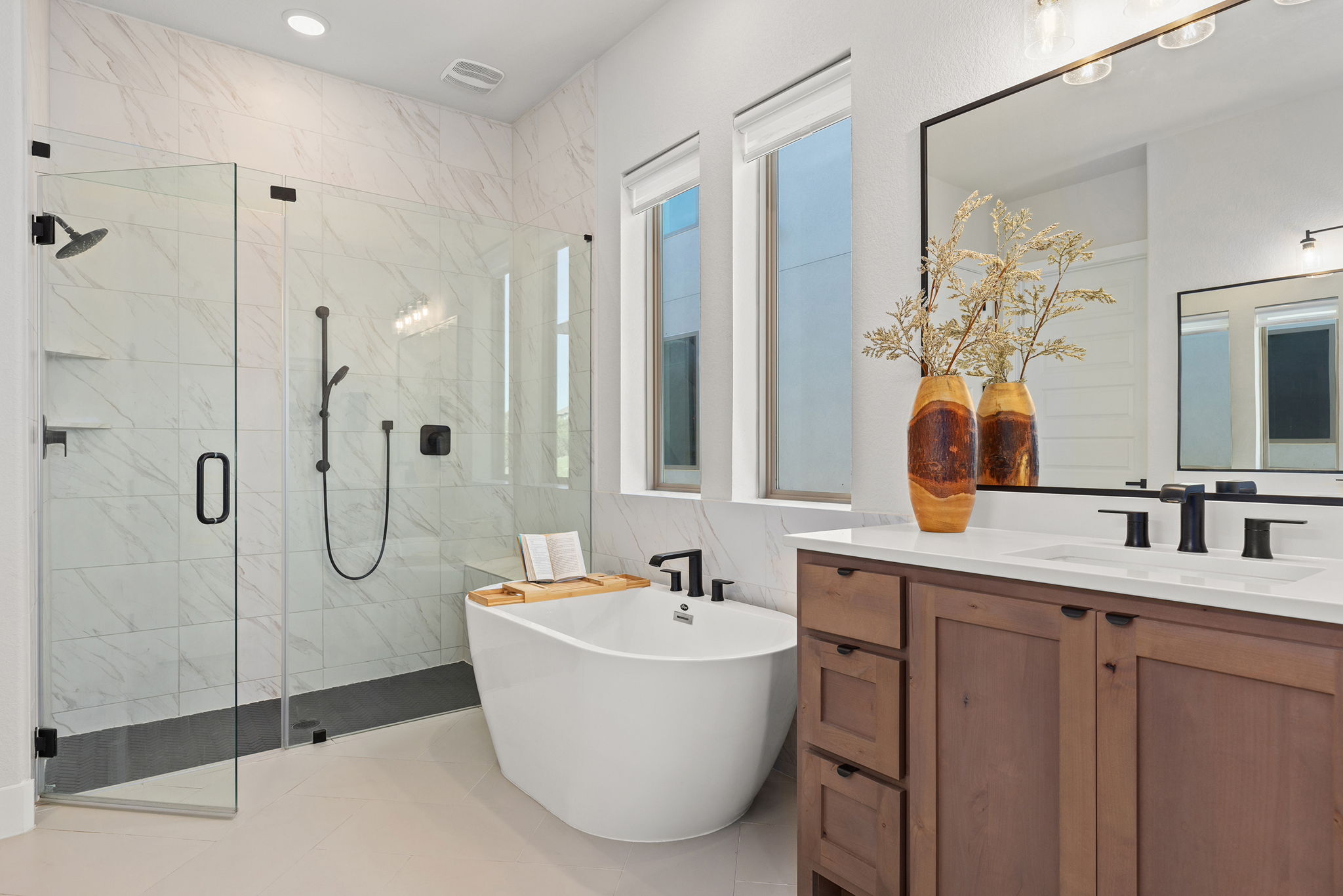 1224 River Trace Georgetown, TX 78628 - Photo 24 of 39 a bathroom with a tub sink shower and mirror