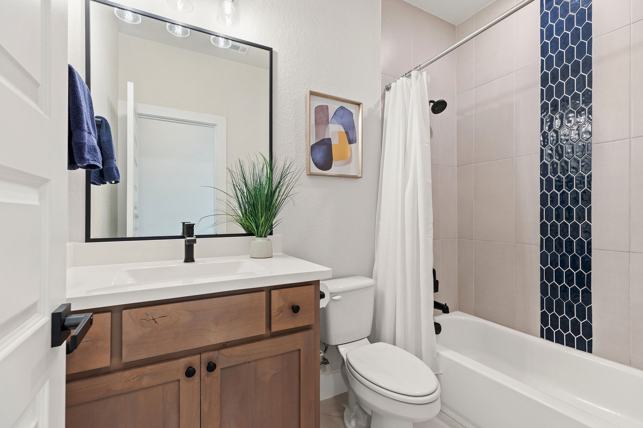 1224 River Trace Georgetown, TX 78628 - Photo 31 of 39 a bathroom with a sink a toilet a tub and shower