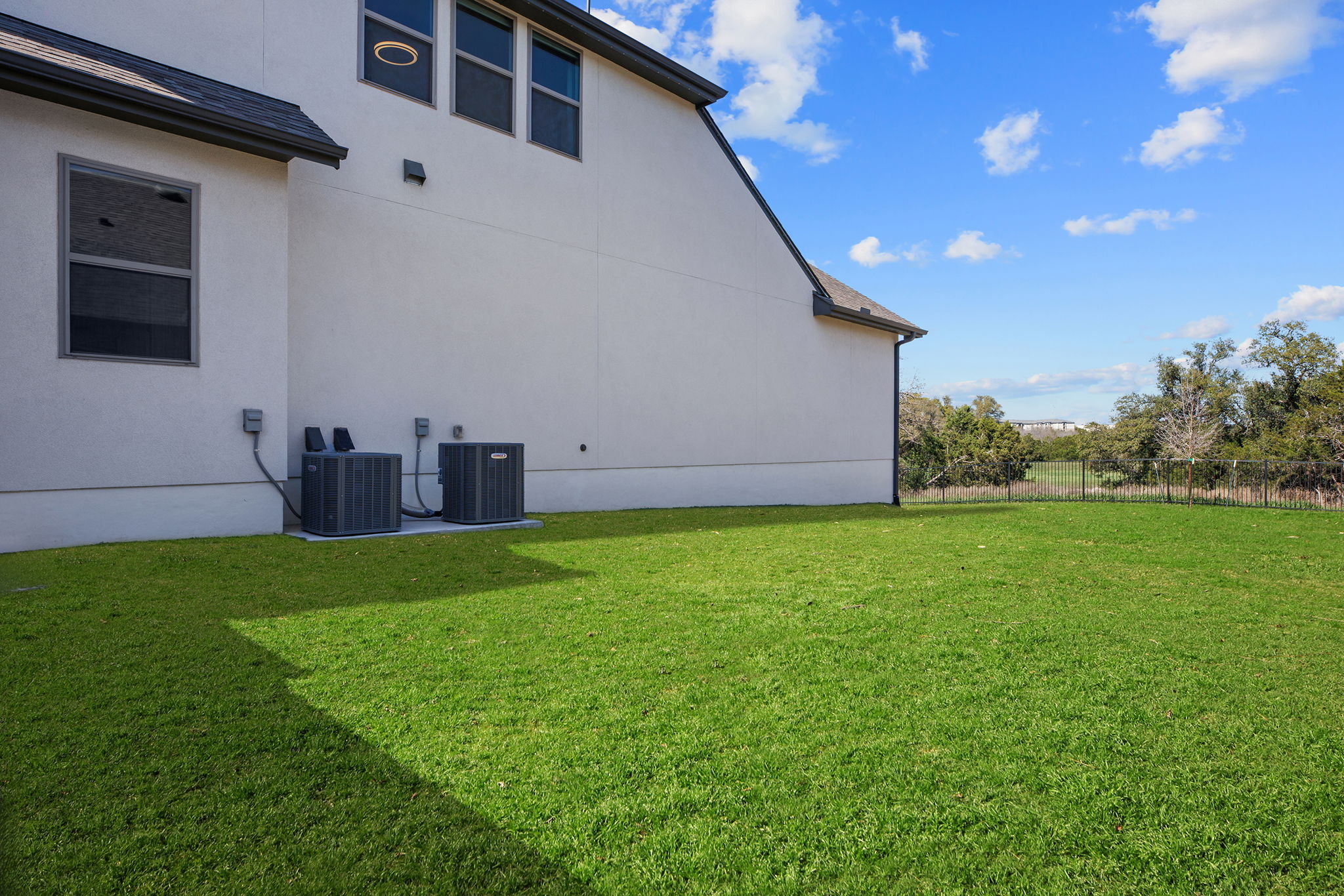 1224 River Trace Georgetown, TX 78628 - Photo 34 of 39 a view of a backyard with potted plants and large tree