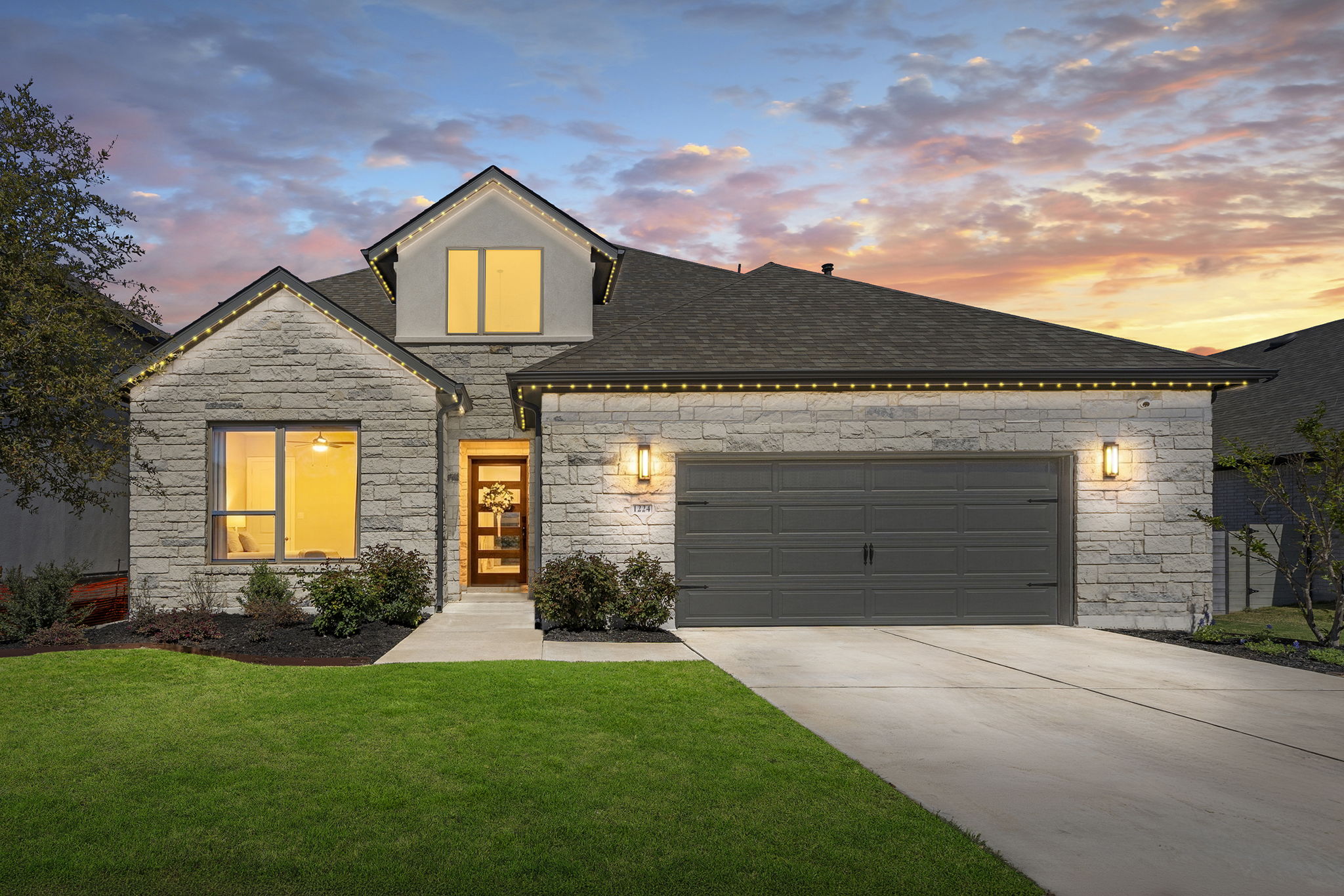 1224 River Trace Georgetown, TX 78628 - Photo 36 of 39 a front view of a house with a yard and garage