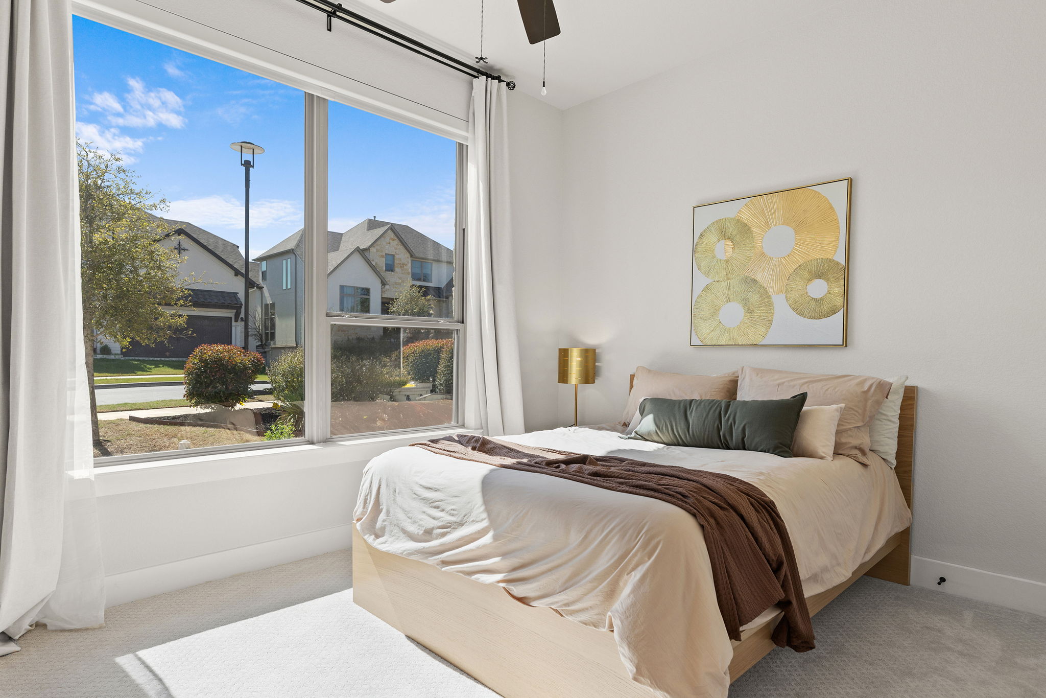 1224 River Trace Georgetown, TX 78628 - Photo 4 of 39 a bedroom with a bed and a painting on the wall