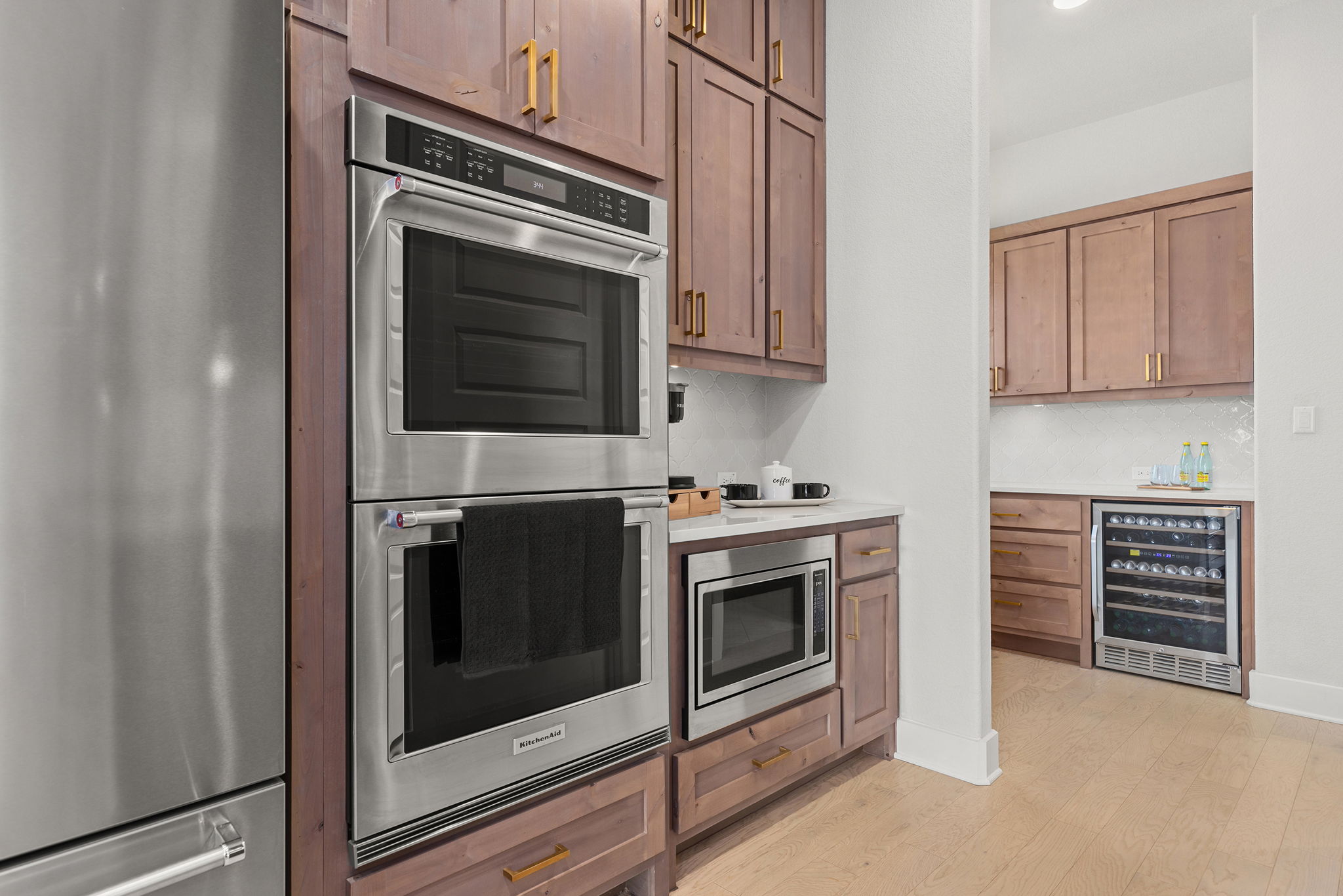 1224 River Trace Georgetown, TX 78628 - Photo 10 of 39 a kitchen with granite countertop white cabinets stainless steel appliances and counter space